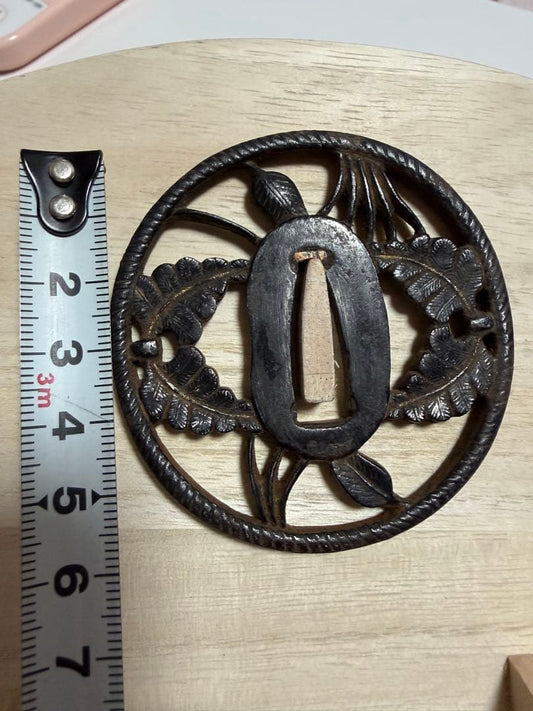 Iron Tsuba Sword Guard with Openwork Floral Design and Wood Display Stand